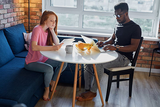 A couple enjoying working from home